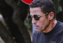 المدرب حسين عموتة ولاعب الأهلي إمام عاشور